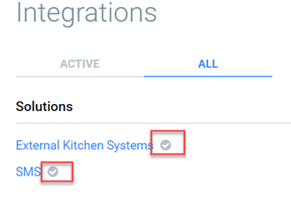 Close-up of the ALL tab Solutions list showing checkmarks next to External Kitchen Systems and SMS, indicating those integrations are active for the location